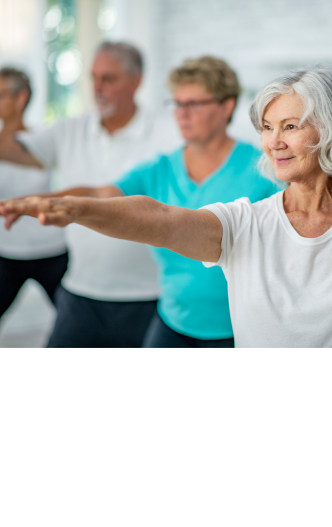 people extending arms in a Tai Chi pose